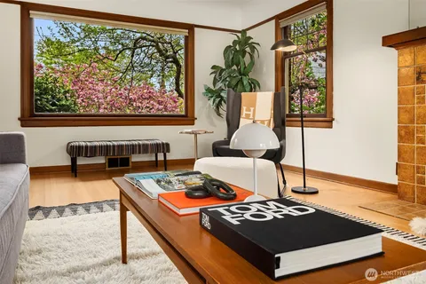 a living room with furniture and a rug