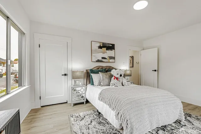 a backyard of a house with table and chairs