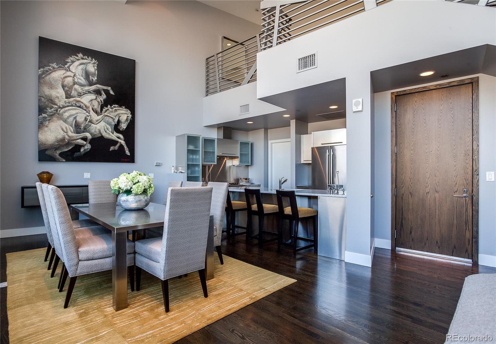 1200 Acoma Street, Unit 603 Denver, CO 80204 - Photo 11 of 30 a view of a dining room with furniture and wooden floor