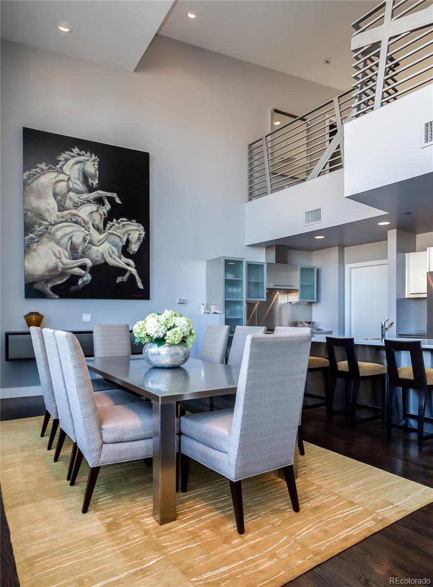 1200 Acoma Street, Unit 603 Denver, CO 80204 - Photo 12 of 30 a dining room with furniture potted plants and wooden floor