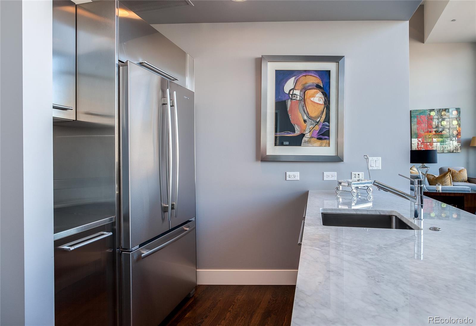 1200 Acoma Street, Unit 603 Denver, CO 80204 - Photo 15 of 30 a living room with furniture and a painting on the wall