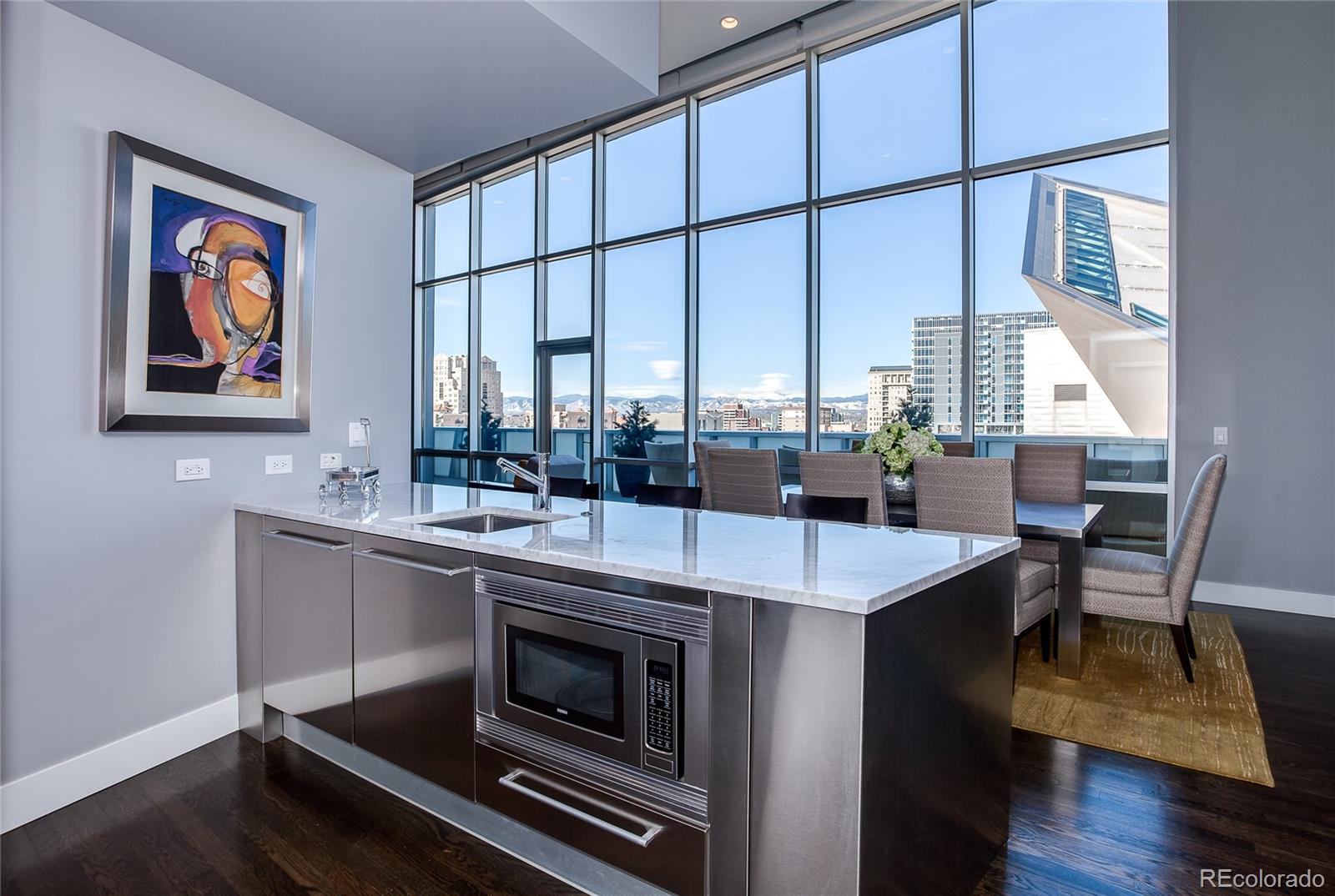 1200 Acoma Street, Unit 603 Denver, CO 80204 - Photo 16 of 30 a dining room with a table chairs and a window