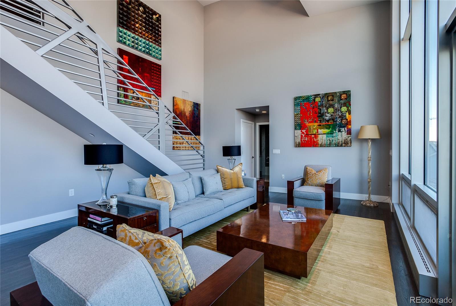 1200 Acoma Street, Unit 603 Denver, CO 80204 - Photo 19 of 30 a living room with furniture and a flat screen tv