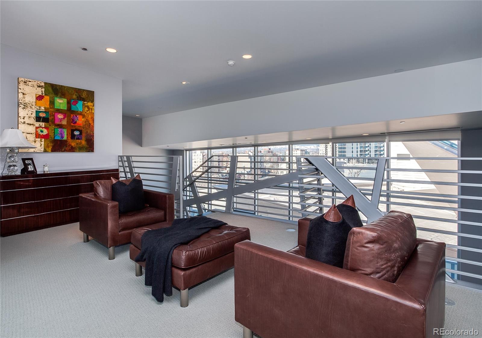 1200 Acoma Street, Unit 603 Denver, CO 80204 - Photo 22 of 30 a living room with furniture and a flat screen tv