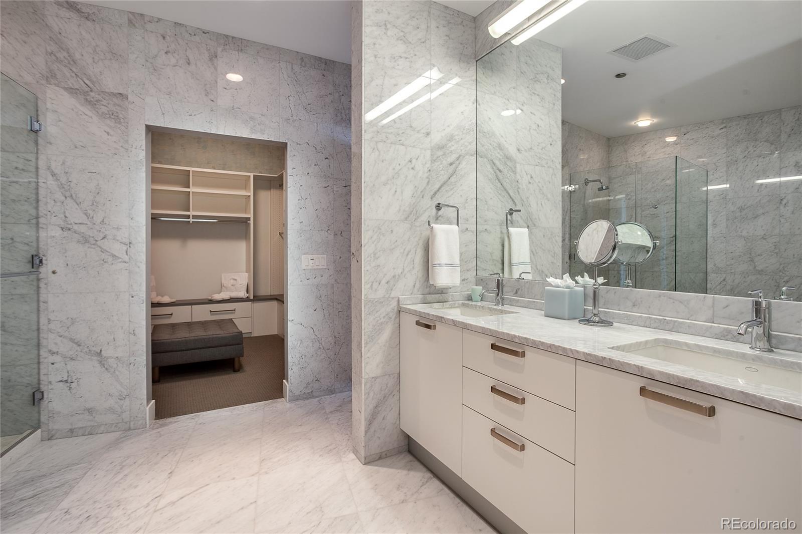 1200 Acoma Street, Unit 603 Denver, CO 80204 - Photo 24 of 30 a bathroom with a double vanity sink and a mirror