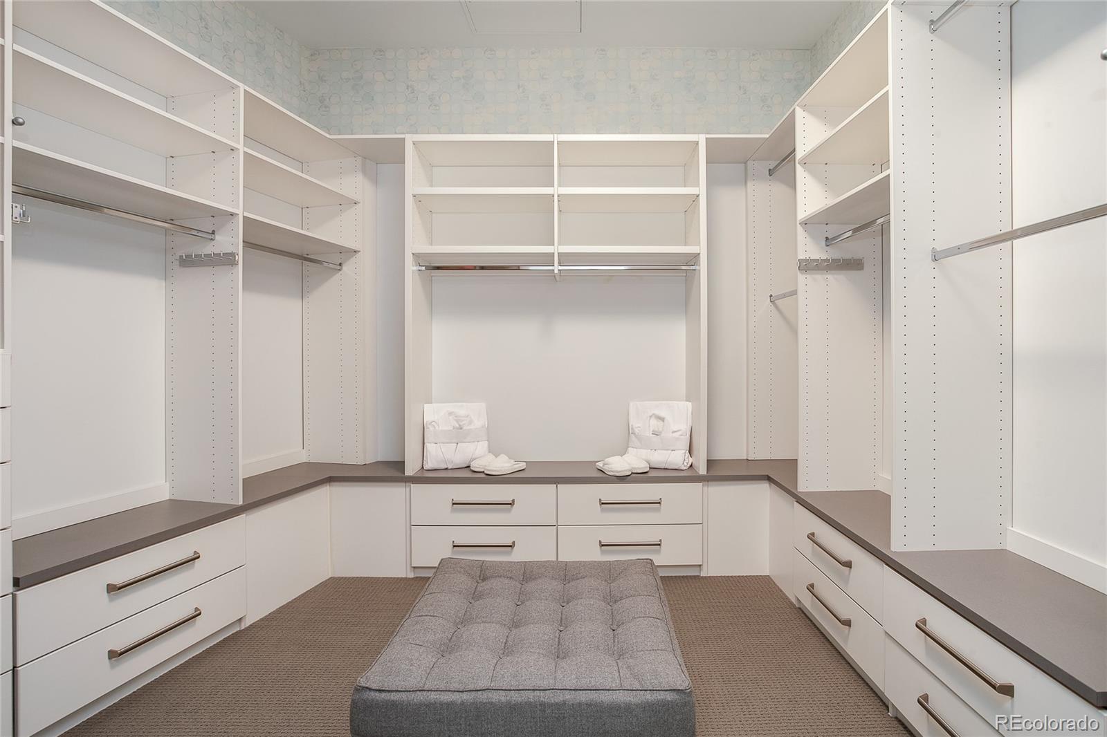 1200 Acoma Street, Unit 603 Denver, CO 80204 - Photo 25 of 30 a room with white cabinets and clock on the wall