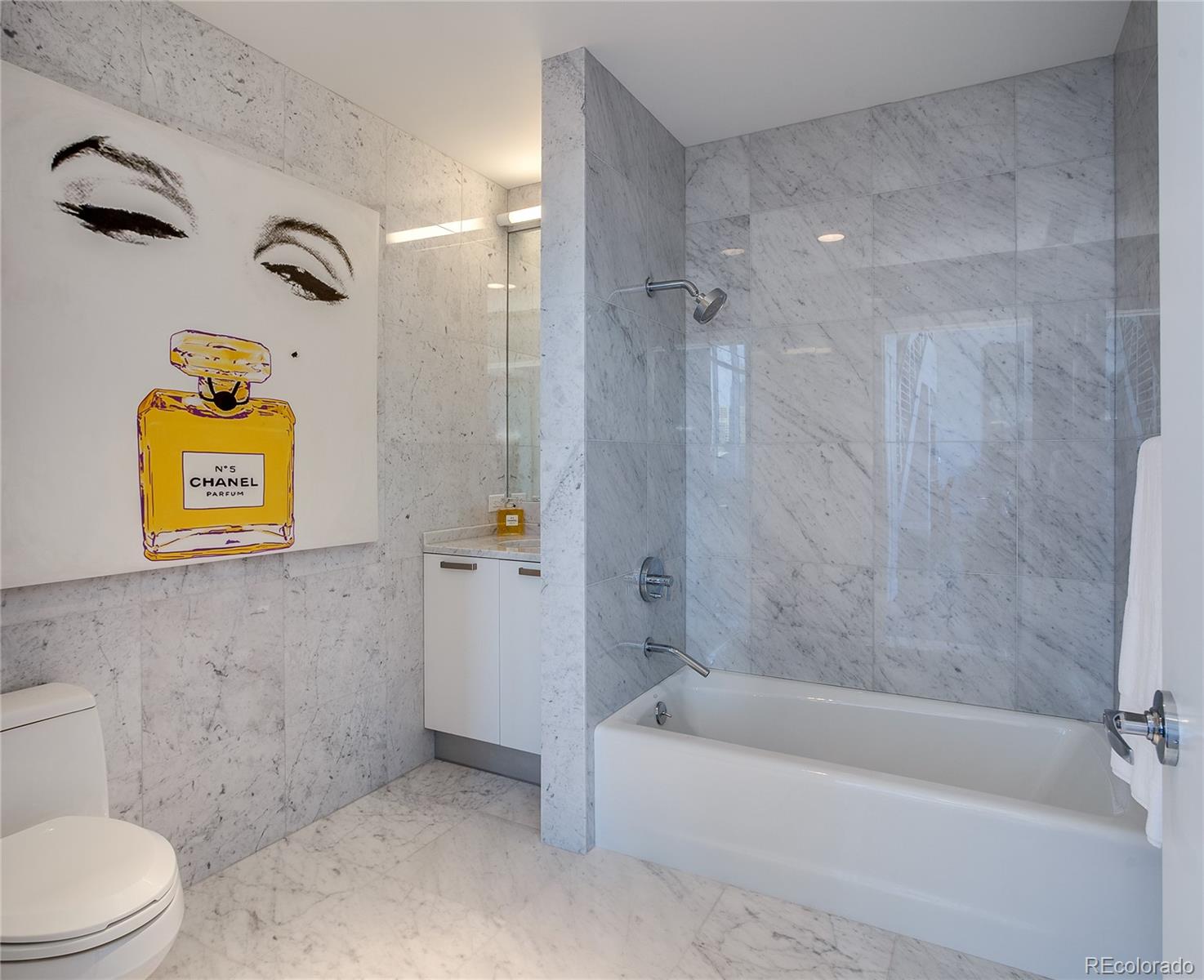 1200 Acoma Street, Unit 603 Denver, CO 80204 - Photo 26 of 30 a bathroom with a bathtub and a toilet