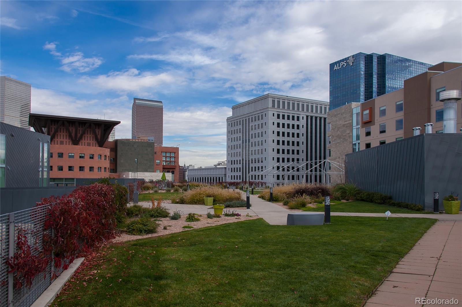 1200 Acoma Street, Unit 603 Denver, CO 80204 - Photo 3 of 30 a front view of a house with a garden