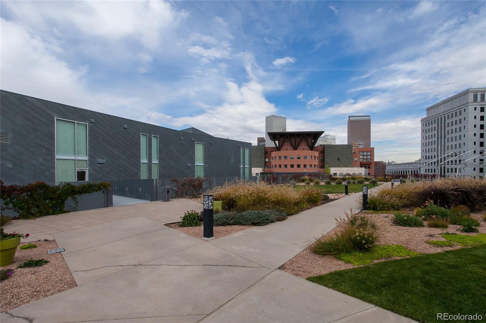 1200 Acoma Street, Unit 603 Denver, CO 80204 - Photo 5 of 30 a front view of a building with garden and parking