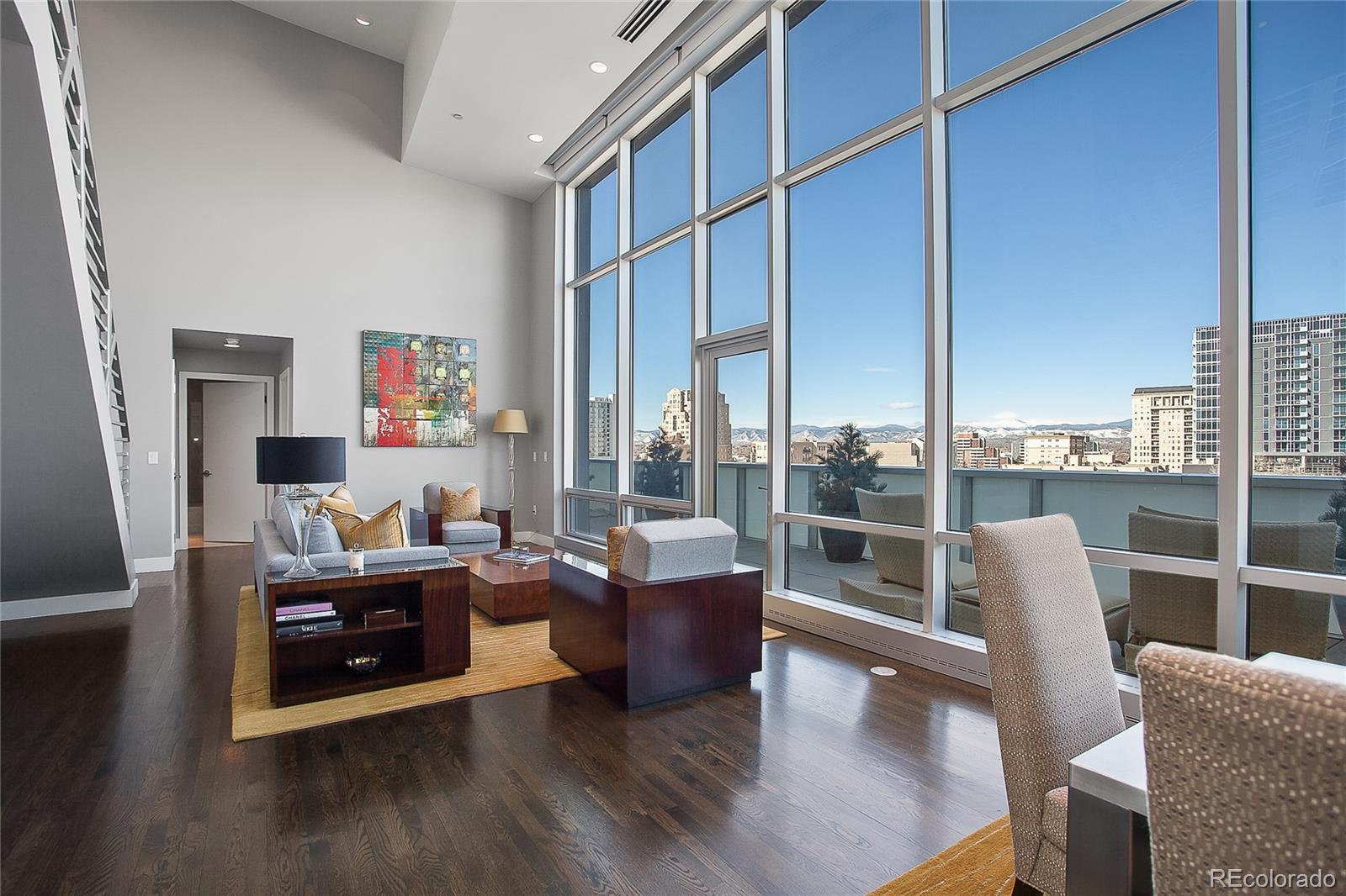 1200 Acoma Street, Unit 603 Denver, CO 80204 - Photo 6 of 30 a living room with furniture and a large window