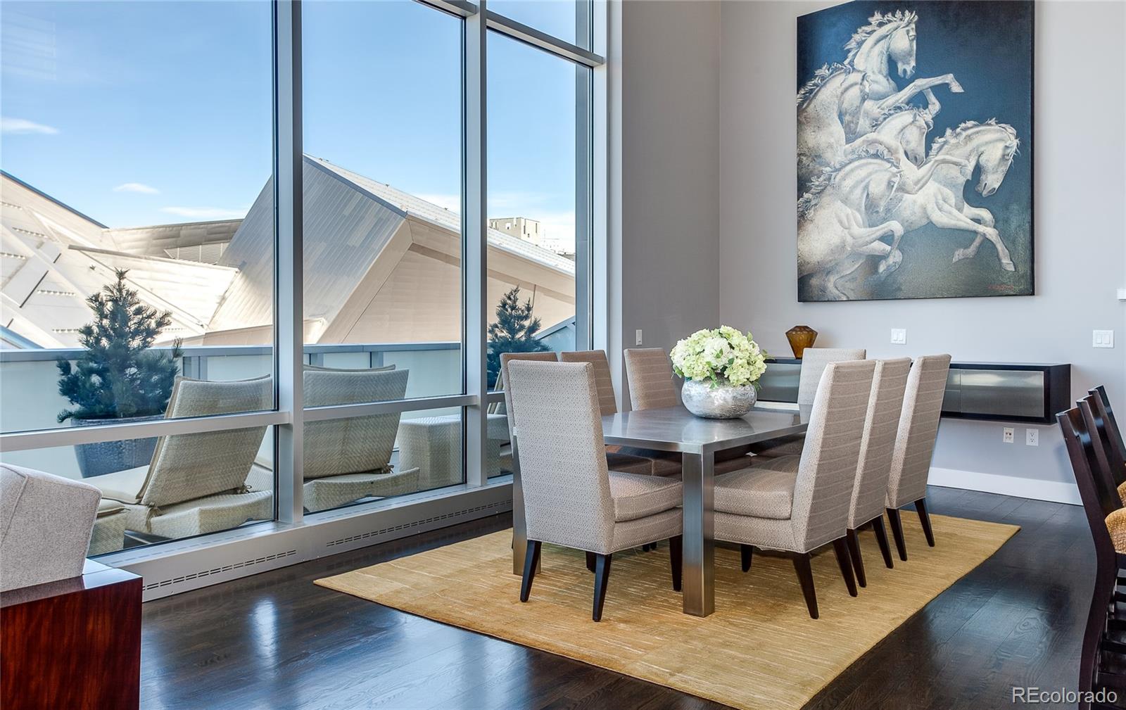 1200 Acoma Street, Unit 603 Denver, CO 80204 - Photo 7 of 30 a dining room with furniture and wooden floor