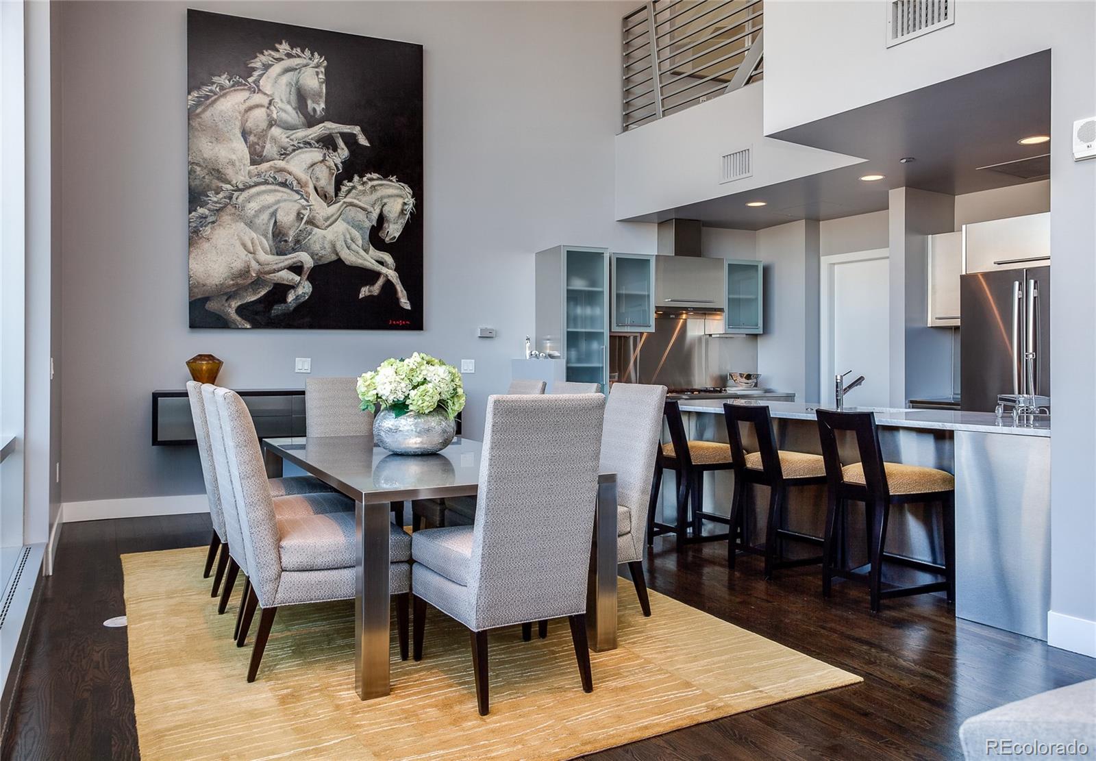 1200 Acoma Street, Unit 603 Denver, CO 80204 - Photo 8 of 30 a view of a dining room with furniture and wooden floor