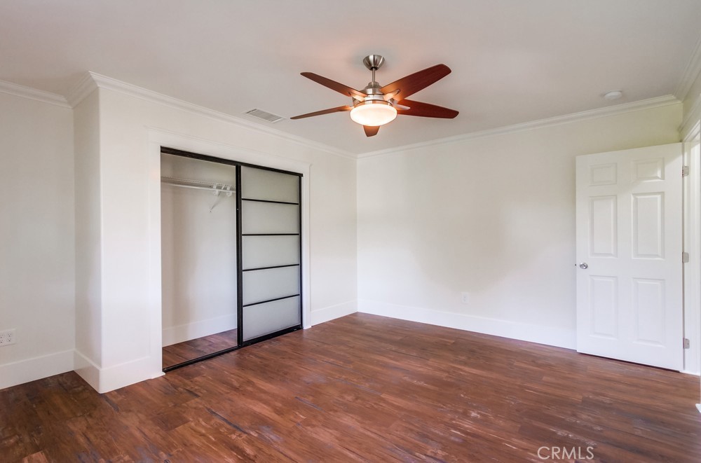 3927 Valle Del Sol Bonsall, CA 92003 - Photo 20 of 41 a view of empty room with wooden floor and fan