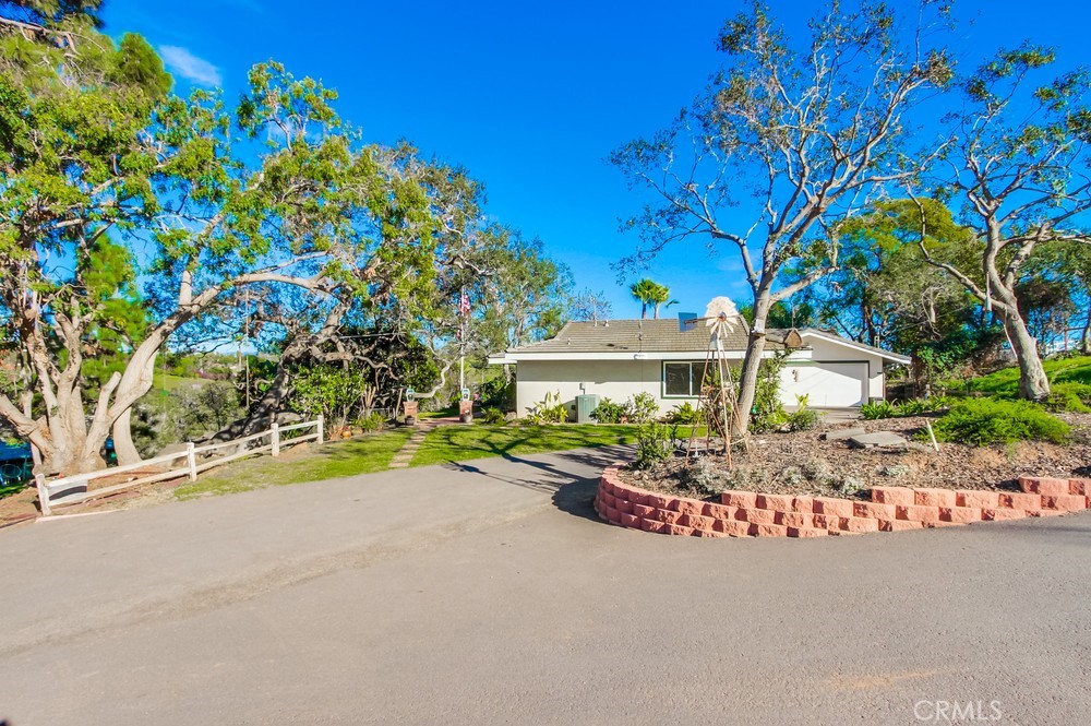 3927 Valle Del Sol Bonsall, CA 92003 - Photo 3 of 41 a view of a house with a tree and pathway