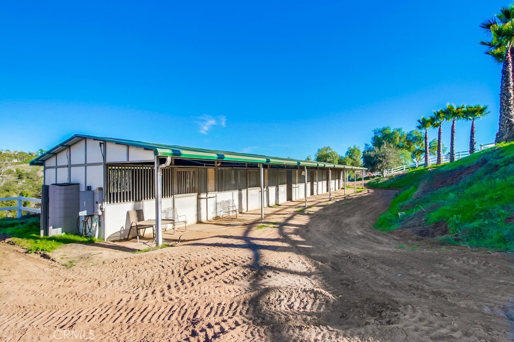 3927 Valle Del Sol Bonsall, CA 92003 - Photo 38 of 41 a house with trees in front of it