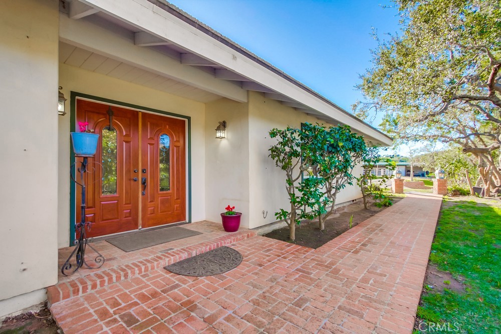 3927 Valle Del Sol Bonsall, CA 92003 - Photo 5 of 41 a front view of a house with a yard