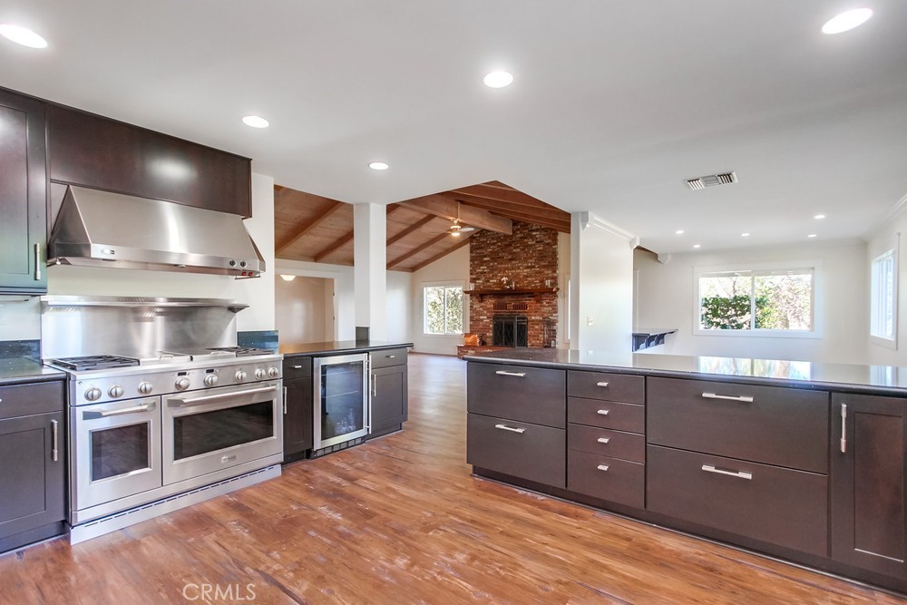 3927 Valle Del Sol Bonsall, CA 92003 - Photo 10 of 41 a kitchen with stainless steel appliances granite countertop a stove and a sink