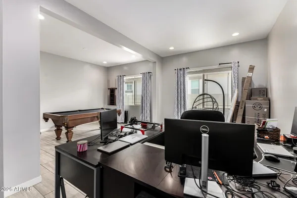 a large kitchen with stainless steel appliances granite countertop a stove a sink a dining table and chairs
