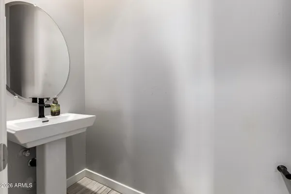 a room with gym equipment and a rug