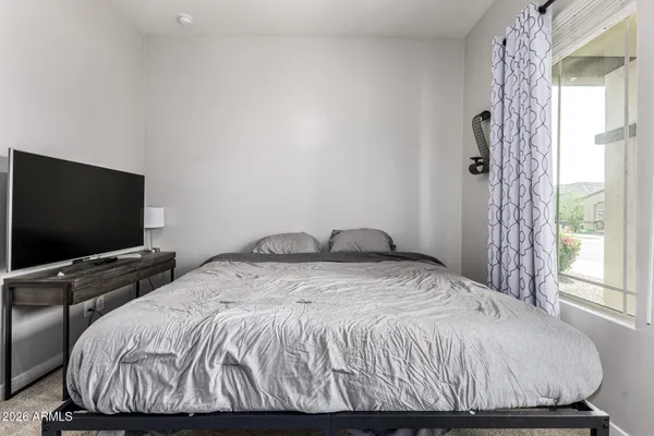 a bedroom with a bed and a view of bedroom