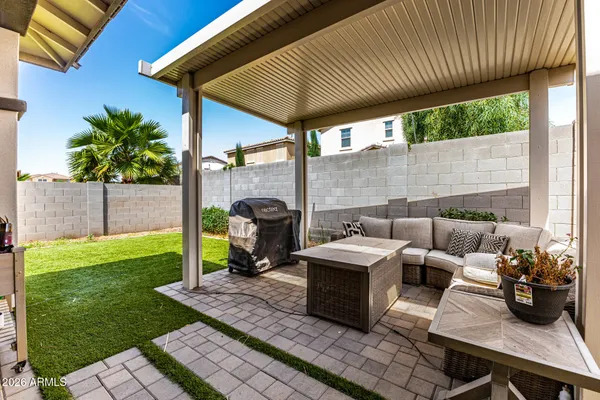 a building outdoor space with patio furniture and potted plants