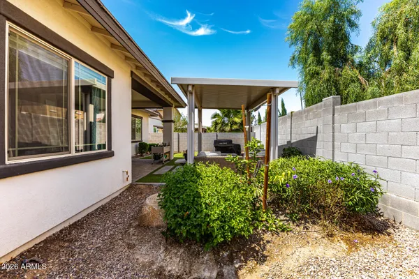 a house view with a backyard space