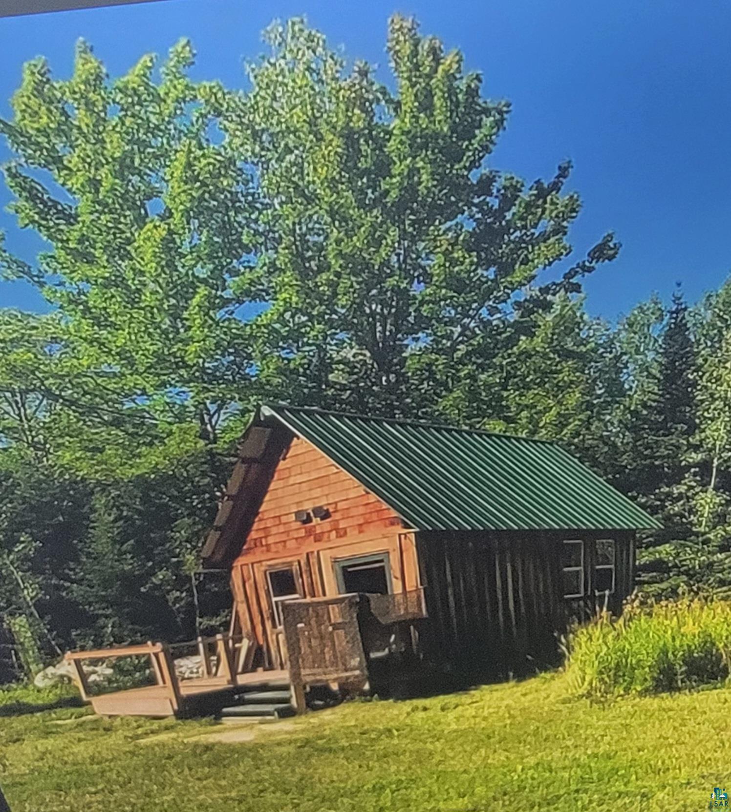 93355 Rowley Road Bayfield, WI 54814 - Photo 1 of 8 Back of house featuring a lawn