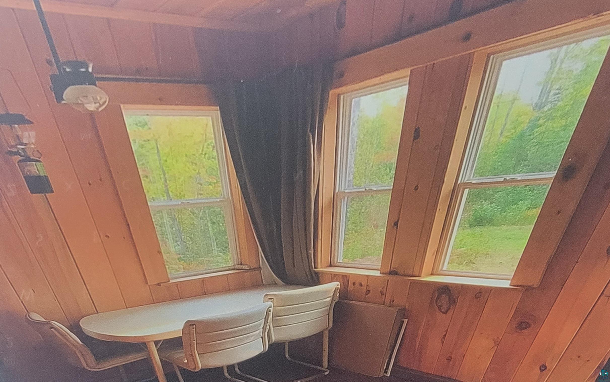 93355 Rowley Road Bayfield, WI 54814 - Photo 6 of 8 Sitting room with wood walls