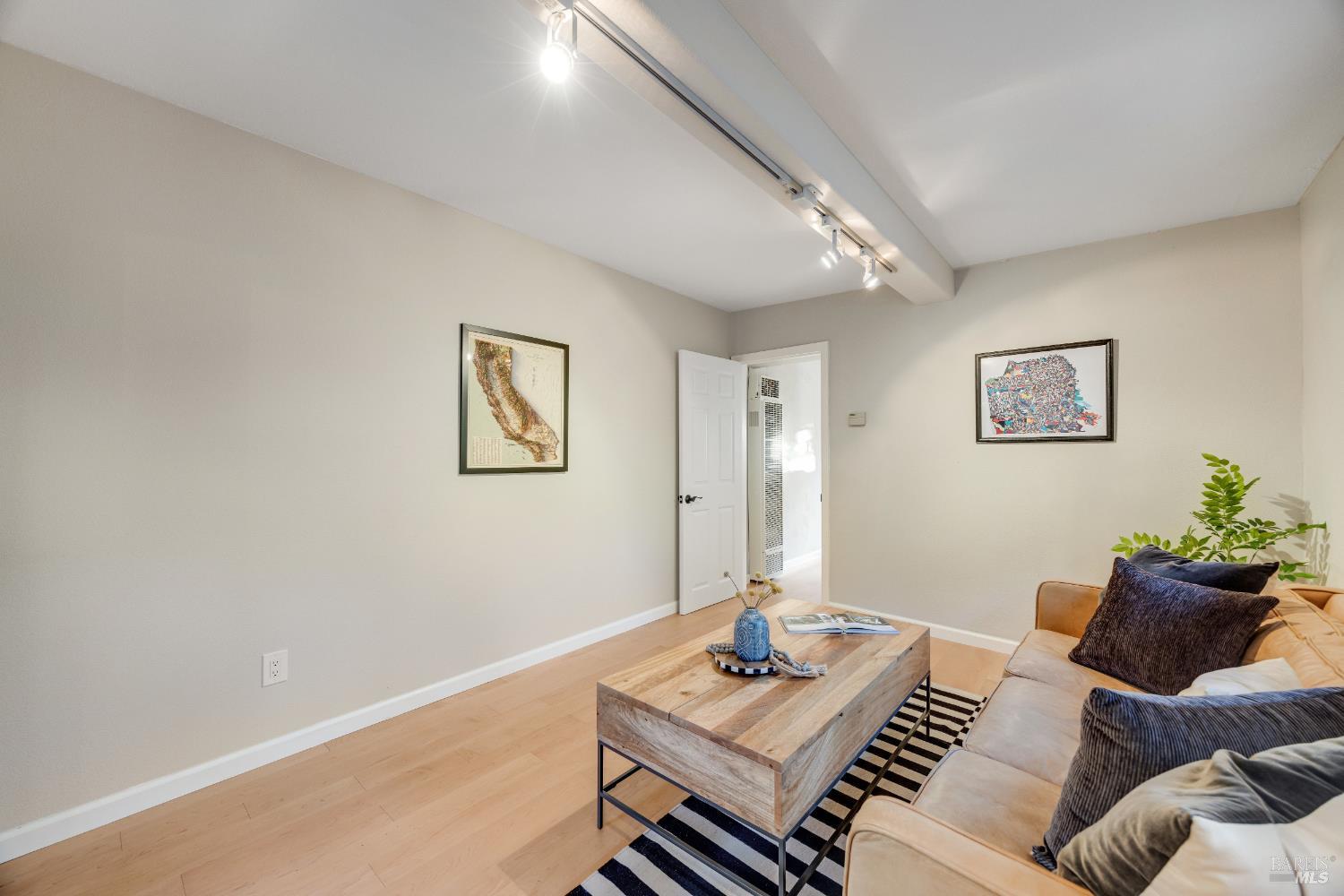 6960 Round Oak Road Penngrove, CA 94951 - Photo 29 of 58 a living room with furniture and wooden floor