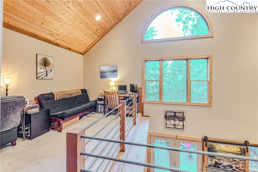 888 Benjamin Drive Boone, NC 28607 - Photo 15 of 38 a living room with a table chair and a window