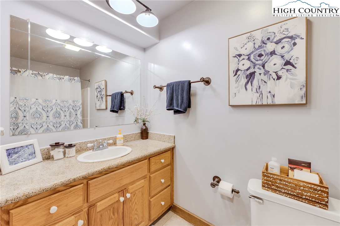 888 Benjamin Drive Boone, NC 28607 - Photo 23 of 38 a bathroom with a sink and a mirror