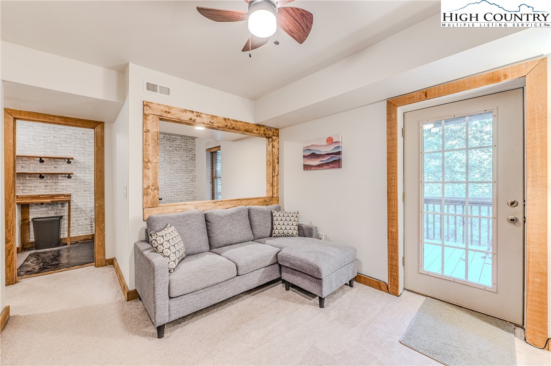 888 Benjamin Drive Boone, NC 28607 - Photo 27 of 38 a living room with furniture and a fireplace