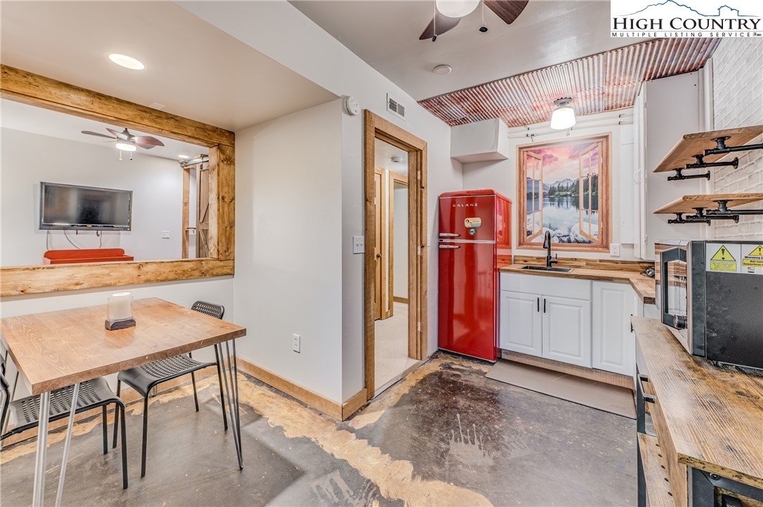 888 Benjamin Drive Boone, NC 28607 - Photo 29 of 38 a view of a kitchen with fridge and workspace