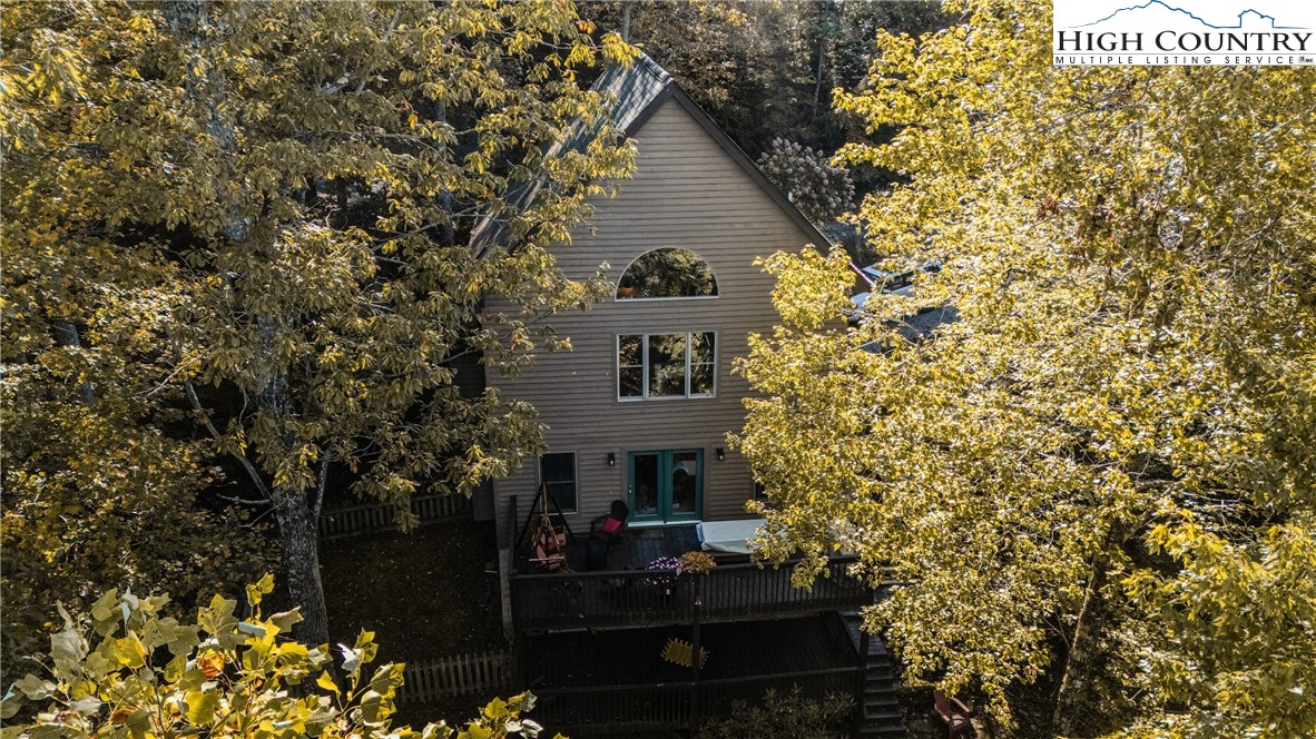 888 Benjamin Drive Boone, NC 28607 - Photo 4 of 38 a front view of a house with a garden