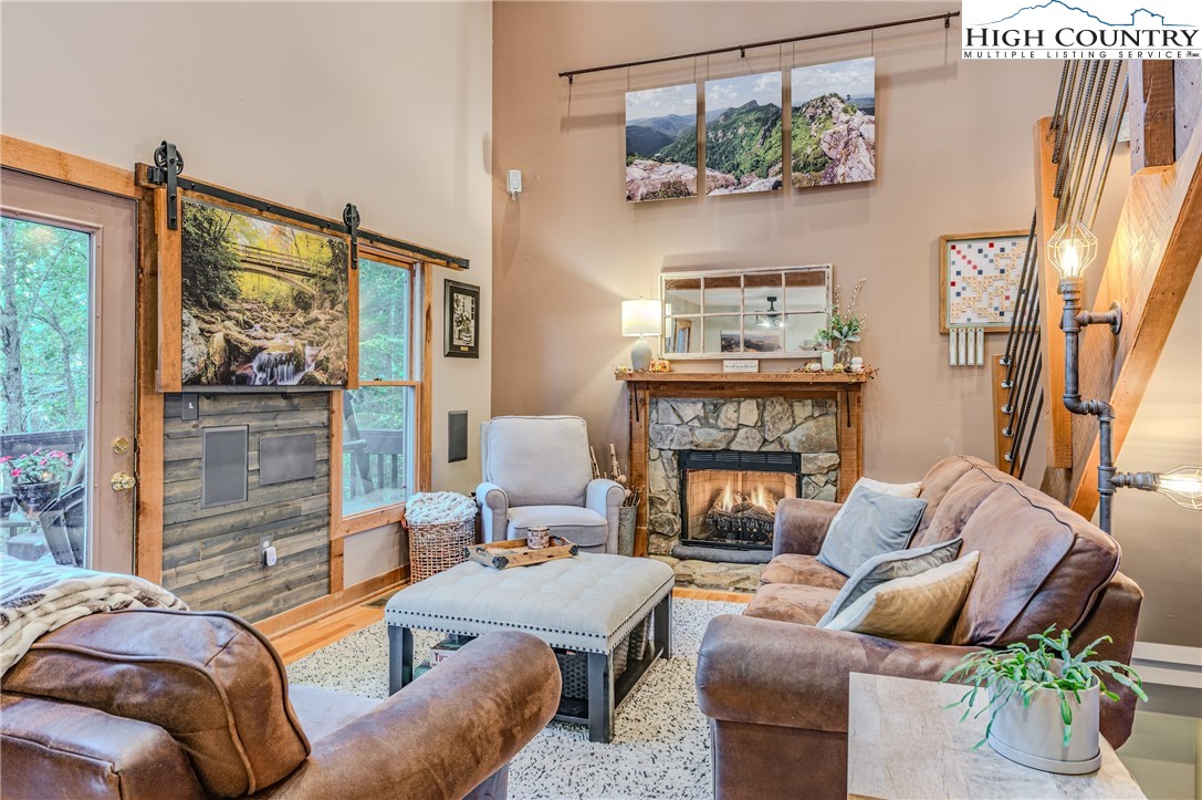 888 Benjamin Drive Boone, NC 28607 - Photo 10 of 38 a living room with furniture and a fireplace