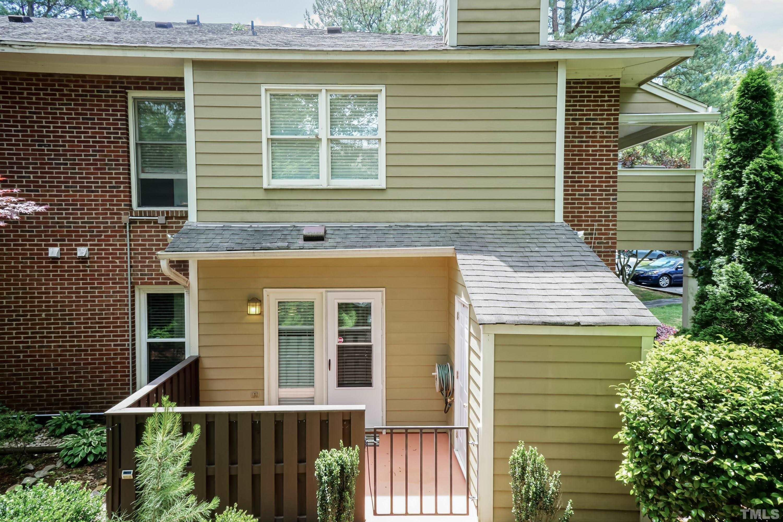 3531 Mill Run, Unit 48 Raleigh, NC 27612 - Photo 21 of 24 a front view of a house with a garage