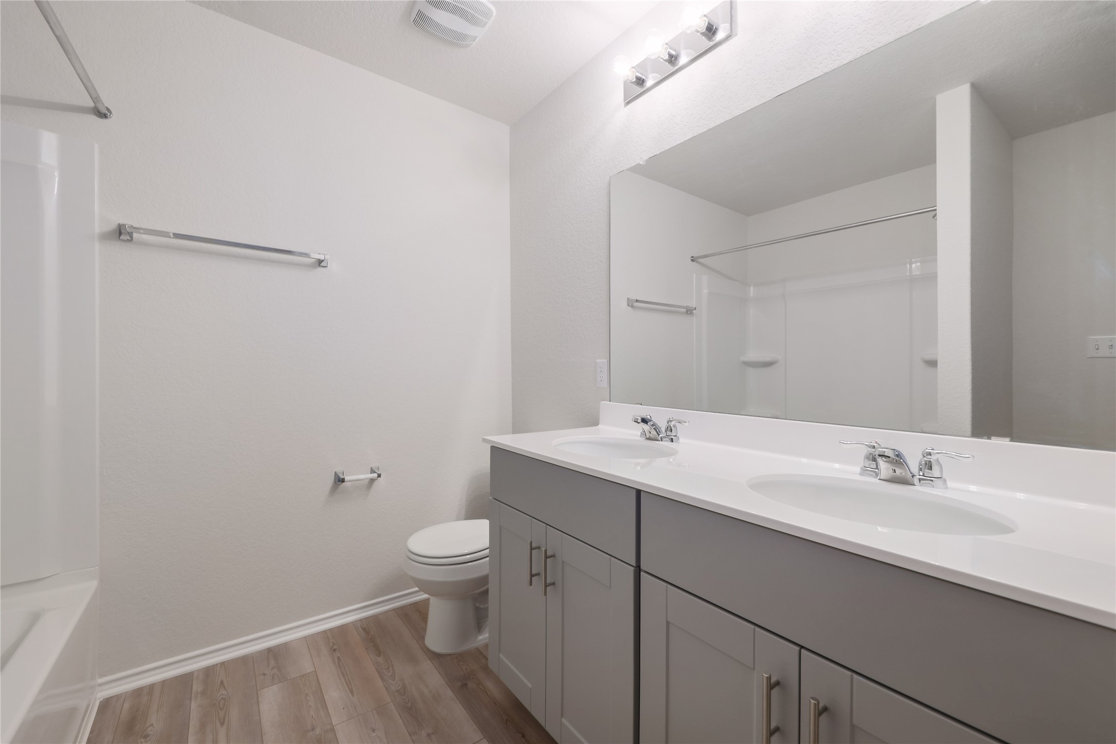 212 Sugar Cane Road Buda, TX 78610 - Photo 30 of 40 The third bathroom with double vanity and shower/tub combo.