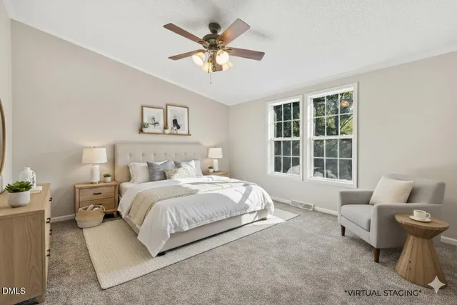 a spacious bedroom with a bed and window
