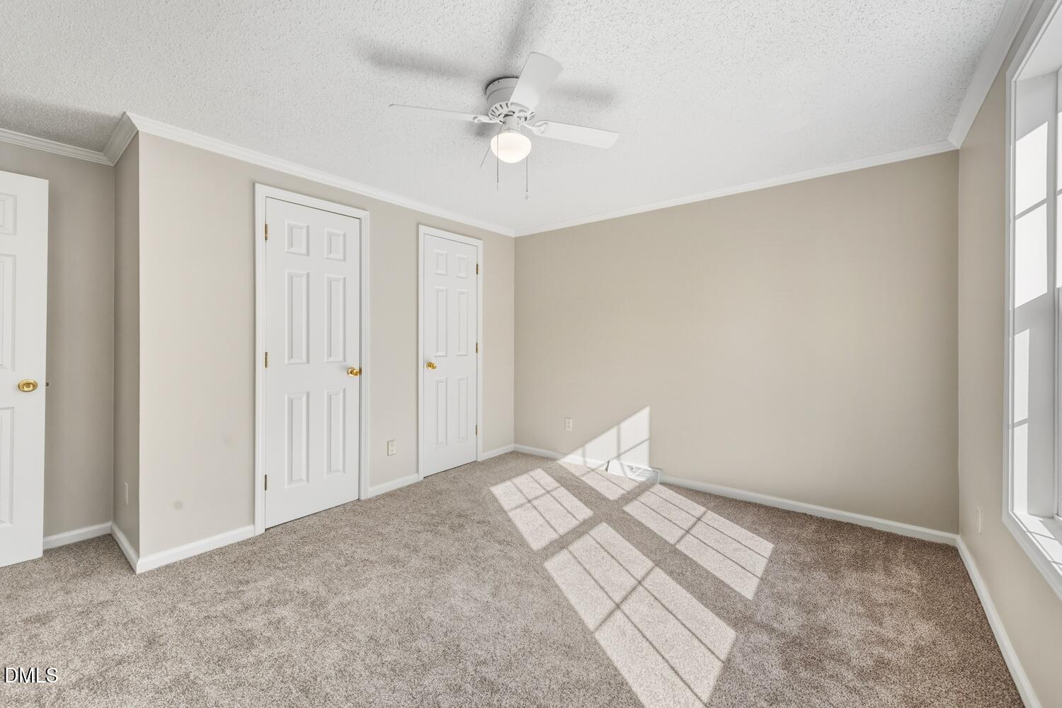 7555 Babe Ruth Trail Snow Camp, NC 27349 - Photo 21 of 38 a view of a bedroom with cabinet and a ceiling fan