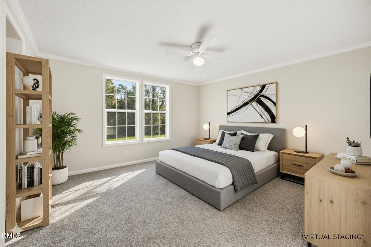 7555 Babe Ruth Trail Snow Camp, NC 27349 - Photo 23 of 38 a spacious bedroom with a bed and a window