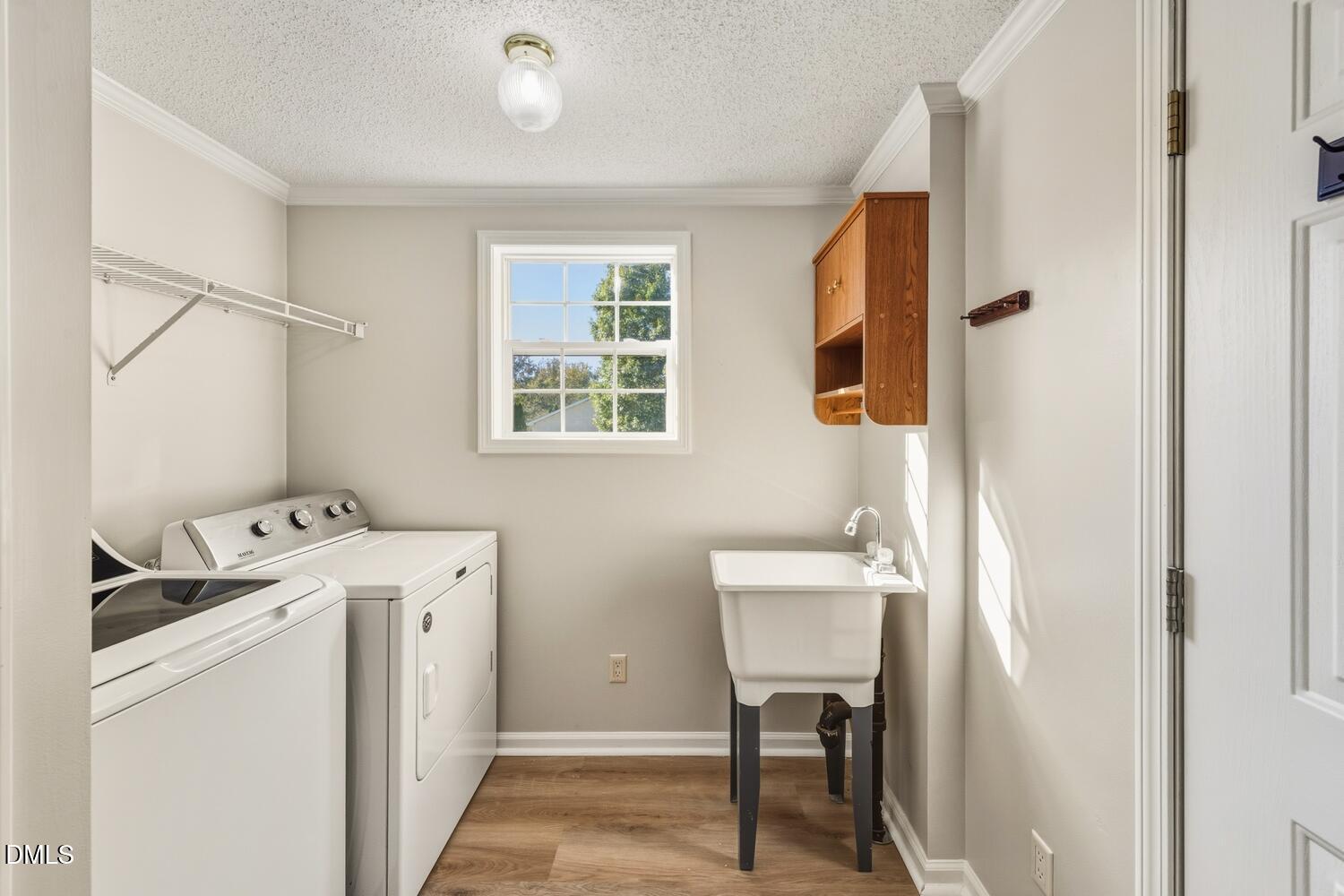 7555 Babe Ruth Trail Snow Camp, NC 27349 - Photo 26 of 38 a room with a window and a washer dryer