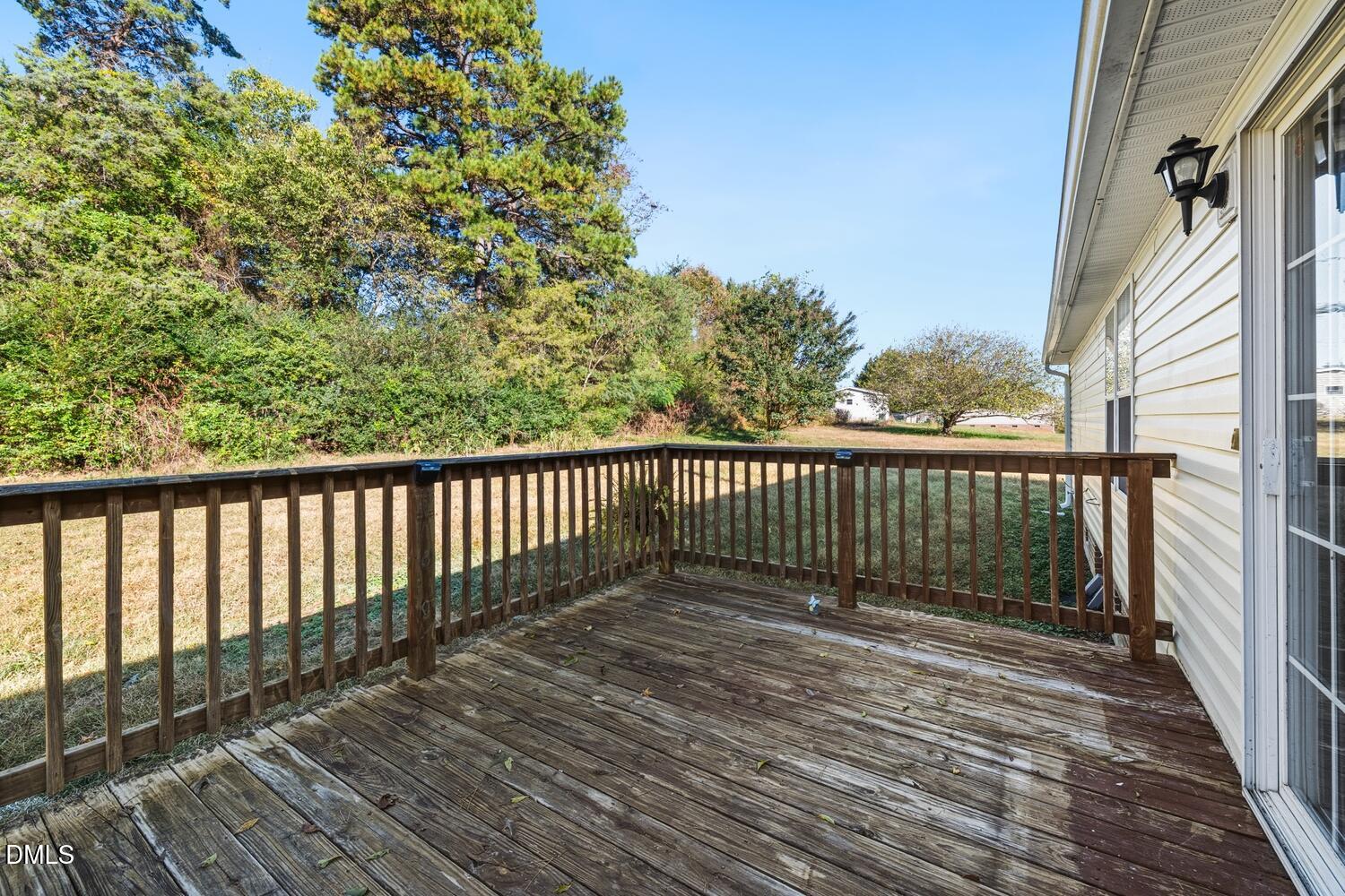 7555 Babe Ruth Trail Snow Camp, NC 27349 - Photo 27 of 38 a balcony with wooden floor and fence