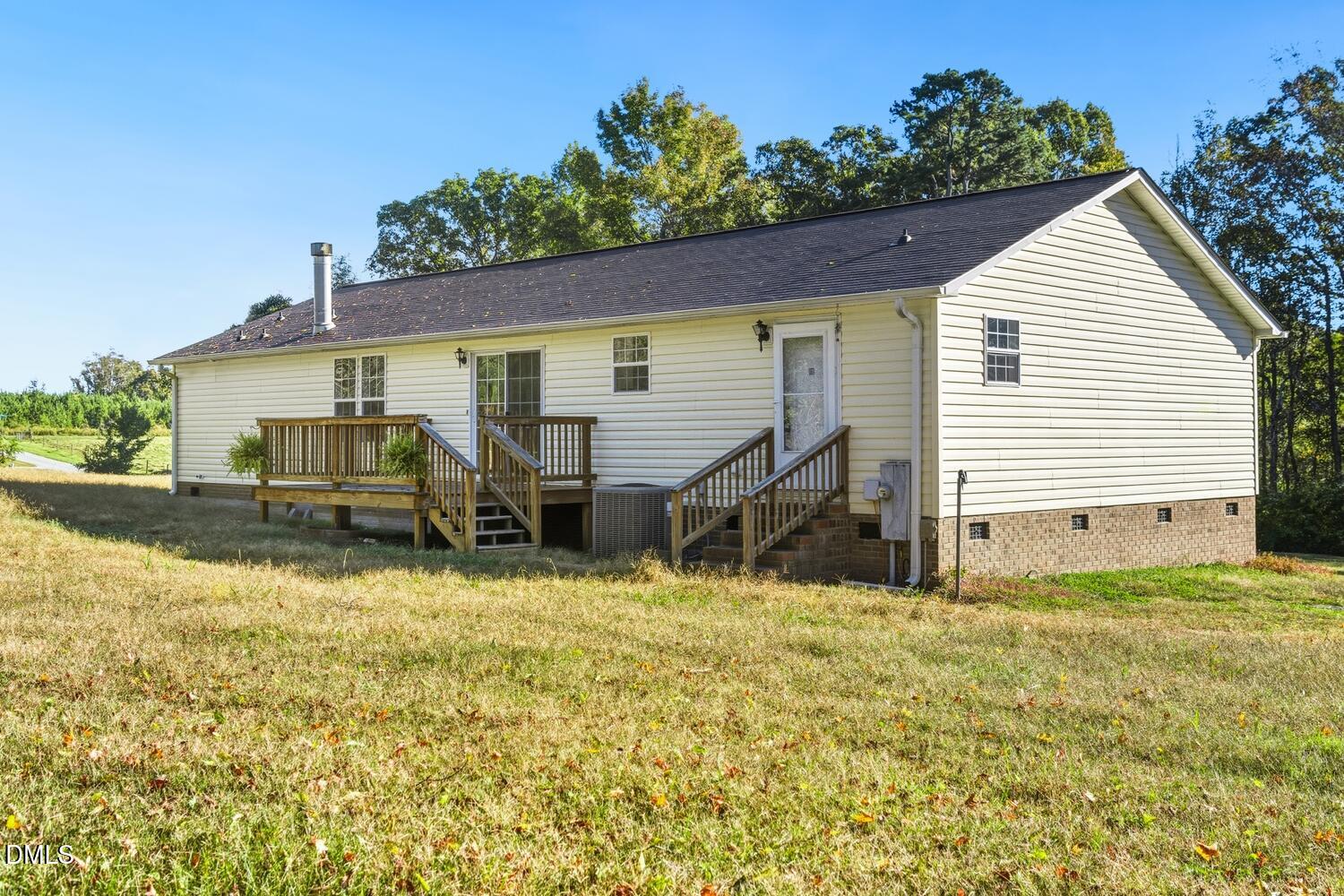 7555 Babe Ruth Trail Snow Camp, NC 27349 - Photo 32 of 38 a view of a house with a yard