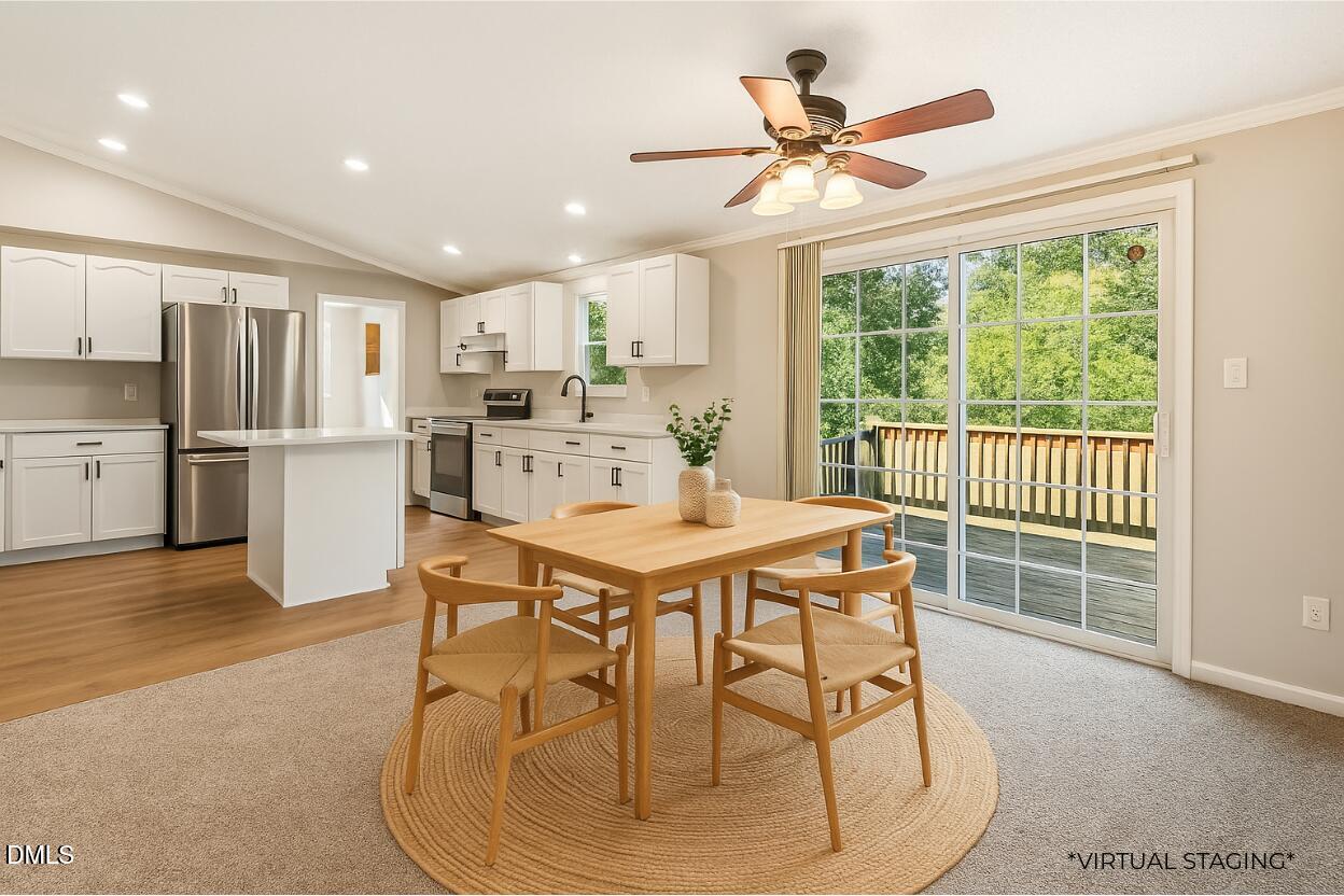 7555 Babe Ruth Trail Snow Camp, NC 27349 - Photo 7 of 38 a dining room with furniture and a large window