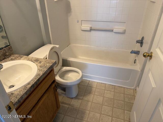 464 Vermont Avenue Green Cove Springs, FL 32043 - Photo 12 of 12 a bathroom with a granite countertop bathtub toilet and sink