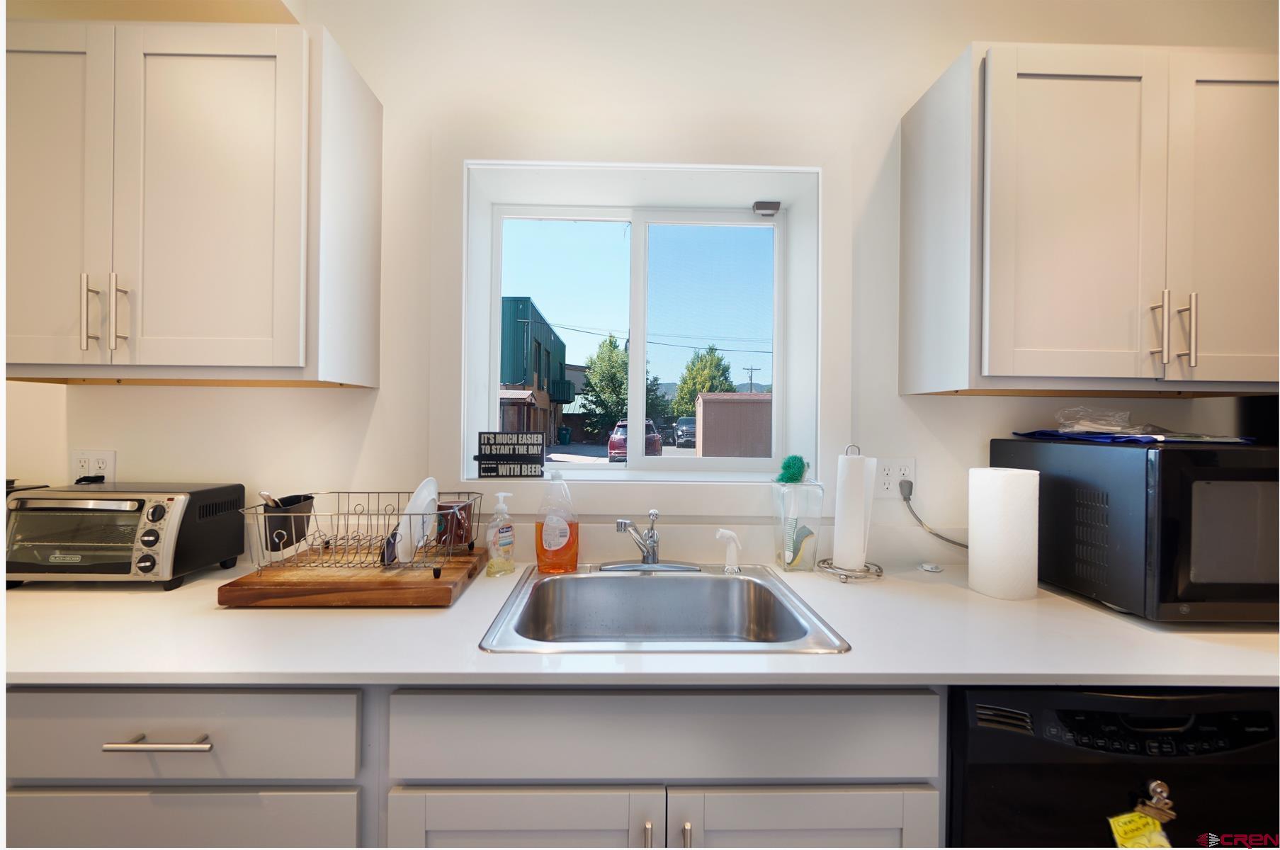3067 Main Avenue Durango, CO 81301 - Photo 16 of 23 a kitchen with a sink and cabinets