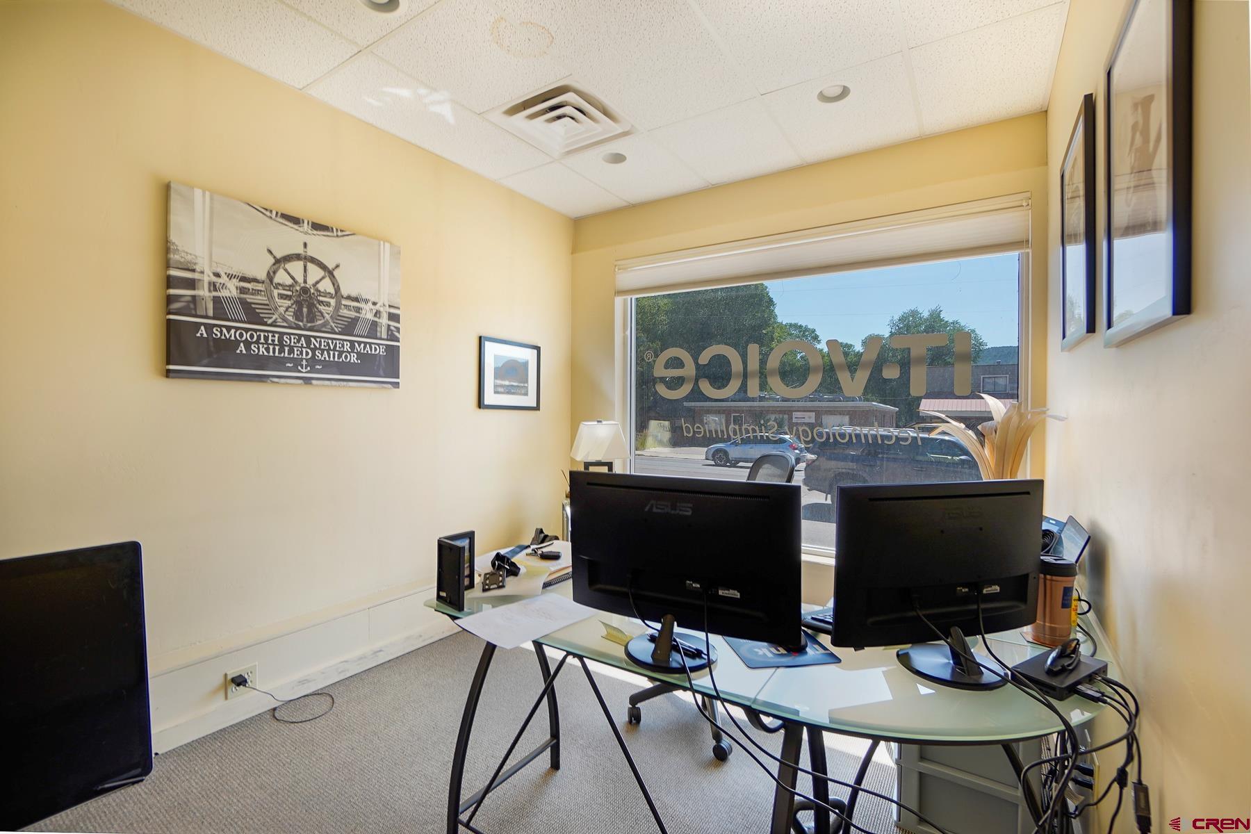 3067 Main Avenue Durango, CO 81301 - Photo 4 of 23 a living room with a table and a fireplace