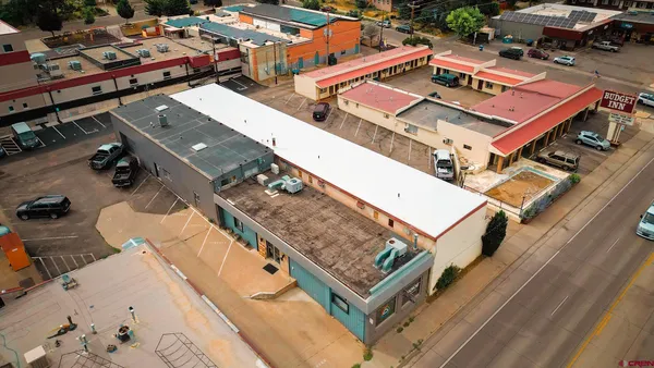 an aerial view of a house with a ocean view