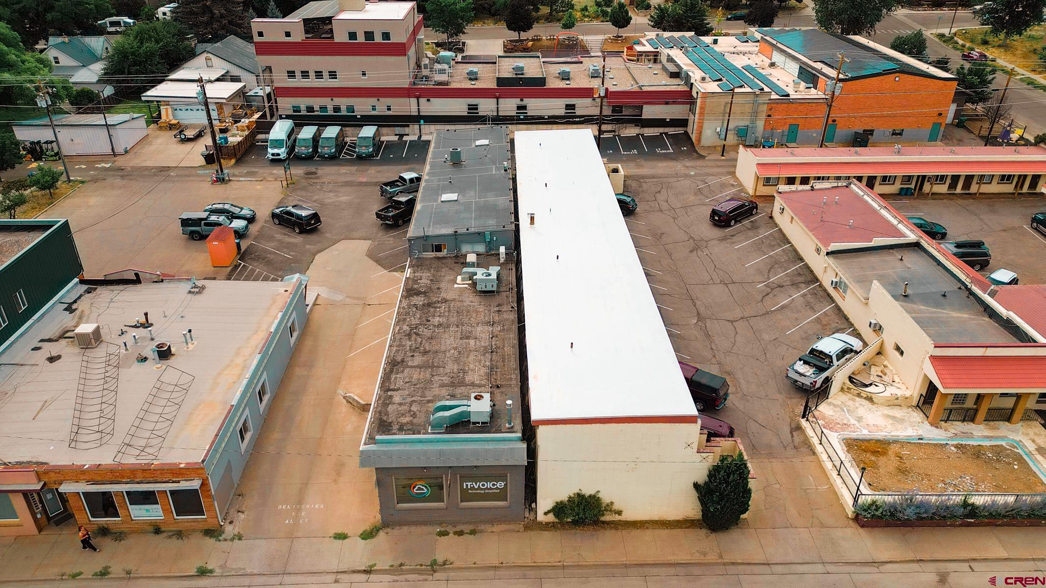 3067 Main Avenue Durango, CO 81301 - Photo 9 of 23 an aerial view of a large building with cars parked