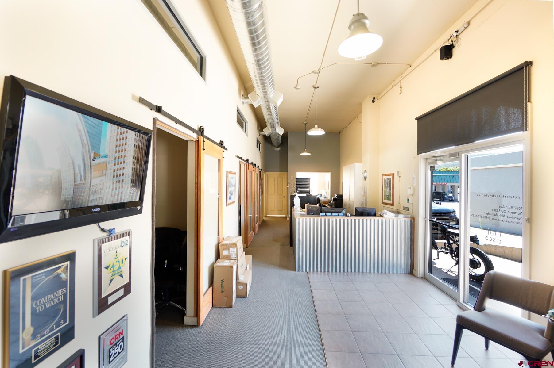 3067 Main Avenue Durango, CO 81301 - Photo 10 of 23 a living room with furniture and a flat screen tv